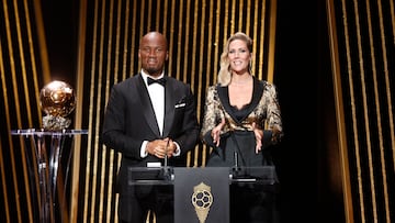 Soccer Football - 2022 Ballon d'Or - Chatelet Theatre, Paris, France - October 17, 2022  Presenters Didier Drogba and Sandy Heribert during the awards REUTERS/Benoit Tessier