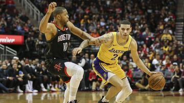 Jan 19, 2019; Houston, TX, USA; Los Angeles Lakers guard Lonzo Ball (2) dribbles the ball as Houston Rockets guard Eric Gordon (10) defends during the third quarter at Toyota Center. Mandatory Credit: Troy Taormina-USA TODAY Sports
