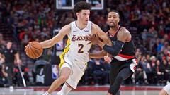 Nov 2, 2017; Portland, OR, USA; Los Angeles Lakers guard Lonzo Ball (2) dribbles past Portland Trail Blazers guard Damian Lillard (0) during the first quarter at the Moda Center. Mandatory Credit: Craig Mitchelldyer-USA TODAY Sports