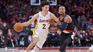 Nov 2, 2017; Portland, OR, USA; Los Angeles Lakers guard Lonzo Ball (2) dribbles past Portland Trail Blazers guard Damian Lillard (0) during the first quarter at the Moda Center. Mandatory Credit: Craig Mitchelldyer-USA TODAY Sports