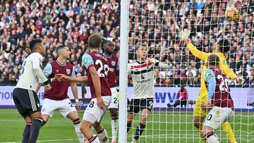 Manchester United's Brazilian midfielder #18 Casemiro (L) heads home their first goal during the English Premier League football match between West Ham United and Manchester United at the London Stadium, in London on October 27, 2024. (Photo by Glyn KIRK / AFP) / RESTRICTED TO EDITORIAL USE. No use with unauthorized audio, video, data, fixture lists, club/league logos or 'live' services. Online in-match use limited to 120 images. An additional 40 images may be used in extra time. No video emulation. Social media in-match use limited to 120 images. An additional 40 images may be used in extra time. No use in betting publications, games or single club/league/player publications. /