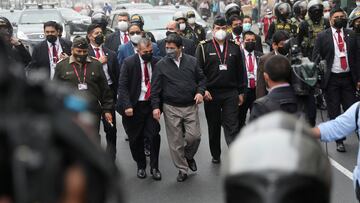 Peru's President Pedro Castillo walks to the National Prosecutor's Office surrounded by his security to give his statement about alleged acts of corruption in Lima, Peru, June 17, 2022. REUTERS/Sebastian Castaneda