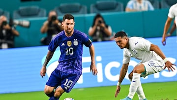 Argentina's Lionel Messi (L) vies for the ball with Honduras's Hector Castellanos during the international friendly match between Honduras and Argentina at Hard Rock Stadium in Miami Gardens, Florida, on September 23, 2022. (Photo by CHANDAN KHANNA / AFP)