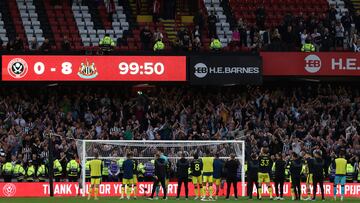 Newcastle players celebrate in front of their fans after the English Premier League football match between Sheffield United and Newcastle United at Bramall Lane in Sheffield, northern England on September 24, 2023. Newcastle won the game 8-0. (Photo by Darren Staples / AFP) / RESTRICTED TO EDITORIAL USE. No use with unauthorized audio, video, data, fixture lists, club/league logos or 'live' services. Online in-match use limited to 120 images. An additional 40 images may be used in extra time. No video emulation. Social media in-match use limited to 120 images. An additional 40 images may be used in extra time. No use in betting publications, games or single club/league/player publications. / 