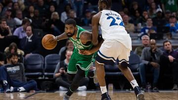 Mar 8, 2018; Minneapolis, MN, USA; Boston Celtics guard Kyrie Irving (11) dribbles against Minnesota Timberwolves guard Andrew Wiggins (22) in the fourth quarter at Target Center. Mandatory Credit: Brad Rempel-USA TODAY Sports