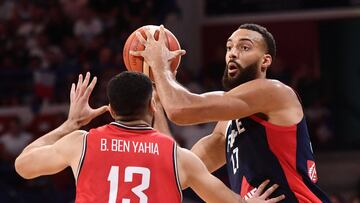 France's Rudy Gobert passes the ball during the FIBA Basketball World Cup 2023 Preparation match between France and Tunisia in Pau, southwestern France