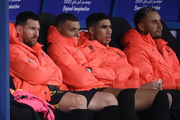 Lionel Messi, Kylian Mbappe, Achraf Hakimi and Costa Rican goalkeeper Keylor Navas look on from the bench during the Riyadh Season Cup match between the Riyadh All-Stars and Paris Saint-Germain at the King Fahd Stadium in Riyadh.