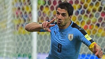 Uruguay's Luis Suarez celebrates after scoring against Brazil during their Russia 2018 FIFA World Cup South American Qualifiers' football match, in Recife, northeastern Brazil, on March 25, 2016.