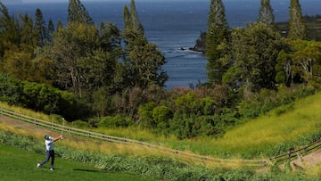 Justin Rose of England plays an approach shot on the 13th hole during the first round of The Sentry at Plantation Course at Kapalua Golf Club