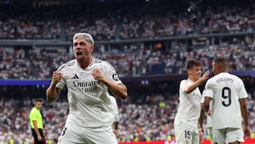 Real Madrid's Uruguayan midfielder #08 Federico Valverde celebrates scoring the opening goal during the Spanish league football match between Real Madrid CF and Real Valladolid FC at the Santiago Bernabeu stadium in Madrid on August 25, 2024. (Photo by Pierre-Philippe MARCOU / AFP)