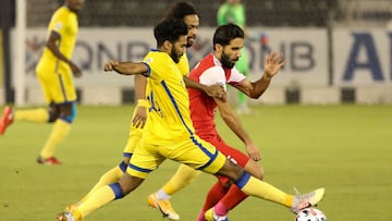 Persepolis&#039; midfielder Bashar Resan (R) is marked by Nassr&#039;s midfielder Khalid Al-Ghannam during the AFC Champions League semi-finals match between Saudi&#039;s Al-Nassr and Iran&#039;s Persepolis on October 3, 2020, at the Jassim Bin Hamad Stad