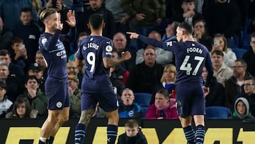 23 October 2021, United Kingdom, Brighton: Manchester City's Phil Foden celebrates (R) celebrates with team-mates after scoring their side's second goal during the English Premier League soccer match between Brighton & Hove Albion and Manche