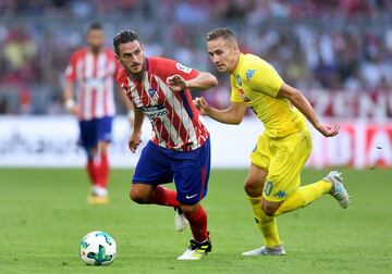 Koke y Marko Rog.