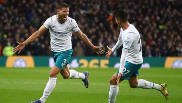 BIRMINGHAM, ENGLAND - DECEMBER 01: Ruben Dias of Manchester City celebrates scoring his side's second goal with team-mate Joao Cancelo during the Premier League match between Aston Villa and Manchester City at Villa Park on December 01, 2021 in Birmi