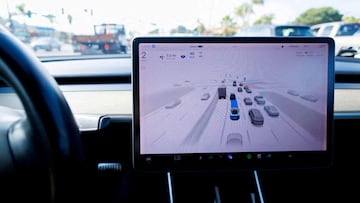 FILE PHOTO: A Tesla Model 3 vehicle drives using FSD (Full Self-Driving) in Encinitas, California, U.S., October 18, 2023. REUTERS/Mike Blake/File Photo