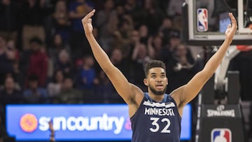 Mar 11, 2018; Minneapolis, MN, USA; Minnesota Timberwolves center Karl-Anthony Towns (32) hold his arms in the air after defeating the Golden State Warriors at Target Center. Mandatory Credit: Jesse Johnson-USA TODAY Sports