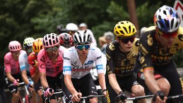 UAE Team Emirates' Slovenian rider Tadej Pogacar wearing the best young rider's white jersey (C) cycles in the lead breakaway with Jumbo-Visma's Danish rider Jonas Vingegaard (2nd R) and Jumbo-Visma's Belgian rider Wout Van Aert (R) in the final ascent of the Col de Cauterets-Cambasque during the 6th stage of the 110th edition of the Tour de France cycling race, 145 km between Tarbes and Cauterets-Cambasque, in the Pyrenees mountains in southwestern France, on July 6, 2023. (Photo by Anne-Christine POUJOULAT / AFP)