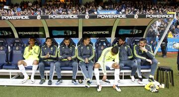 Isco chats with James on the bench 