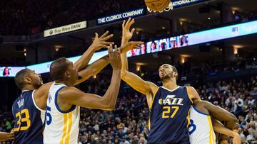 Apr 10, 2017; Oakland, CA, USA; Utah Jazz center Rudy Gobert (27) holds back Golden State Warriors forward Draymond Green (23) as b battle for the ball against Golden State Warriors forward Kevin Durant (35) with Utah Jazz center Boris Diaw (33) during the third quarter at Oracle Arena. The Jazz won 105-99. Mandatory Credit: Kelley L Cox-USA TODAY Sports