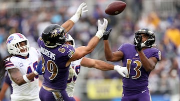 BALTIMORE, MARYLAND - OCTOBER 02: Mark Andrews #89 and Devin Duvernay #13 of the Baltimore Ravens attempt to make a catch in the second quarter against the Buffalo Bills at M&T Bank Stadium on October 02, 2022 in Baltimore, Maryland. Patrick Smith/Getty Images/AFP