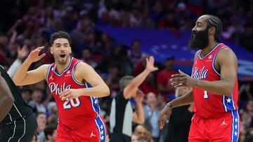 Georges Niang #20 and James Harden #1 of the Philadelphia 76ers react against the Brooklyn Nets in the fourth quarter during Game One of the Eastern Conference First Round Playoffs at the Wells Fargo Center on April 15, 2023 in Philadelphia, Pennsylvania. The 76ers defeated the Nets 121-101.