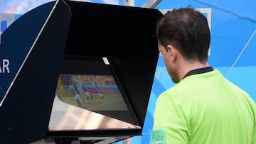 KAZAN, RUSSIA - JUNE 16: Referee Andres Cunha reviews the VAR footage, before awarding France a penalty during the 2018 FIFA World Cup Russia group C match between France and Australia at Kazan Arena on June 16, 2018 in Kazan, Russia. (Photo by Michael Regan - FIFA/FIFA via Getty Images)