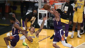 LOS ANGELES, CALIFORNIA - JUNE 03: Kyle Kuzma #0 of the Los Angeles Lakers reacts as he has his shot blocked by Devin Booker #1 and Mikal Bridges #25 of the Phoenix Suns in a 113-100 Suns win during game six of the Western Conference first round series at Staples Center on June 03, 2021 in Los Angeles, California. Harry How/Getty Images/AFP NOTE TO USER: User expressly acknowledges and agrees that, by downloading and or using this photograph, User is consenting to the terms and conditions of the Getty Images License Agreement.
== FOR NEWSPAPERS, INTERNET, TELCOS & TELEVISION USE ONLY ==