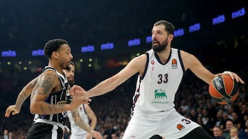 Milans's Nikola Mirotic (R) in action against Partizan's Carlik Jones (L) during the Euroleague basketball match between Partizan Belgrade and Emporio Armani Milan in Belgrade, Serbia, 15 November 2024.