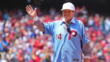 (FILES) Former Philadelphia Phillies player Pete Rose acknowledges the crowd prior to the game against the Washington Nationals at Citizens Bank Park on August 7, 2022 in Philadelphia, Pennsylvania. US President Donald Trump said on February 28, 2025 he would posthumously pardon Pete Rose, the baseball great who was banned for life for betting on games and later jailed for tax evasion. The US president also reiterated his call for Rose -- who died last year aged 83 and was Major League Baseball's all-time hit king -- to be inducted into the Hall of Fame. (Photo by Mitchell Leff / GETTY IMAGES NORTH AMERICA / AFP)