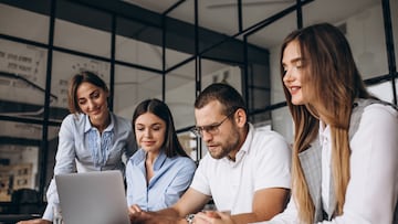 Group of people working out business plan in an office