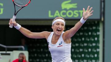 Timea Bacsinszky celebrates her victory over Simona Halep. 