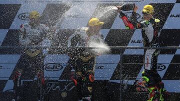 Motorcycling - Moto3 - French Grand Prix - Bugatti Circuit, Le Mans, France - May 20, 2018   Angel Nieto Team Moto3&#039;s Albert Arenas celebrates winning the race on the podium as Angel Nieto Team Moto3&#039;s Andrea Migno and Bester Capital Dubai&#039;