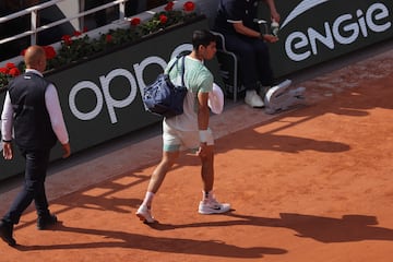 Carlos Alcaraz leaves the court for a break against Serbia's Novak Djokovic.