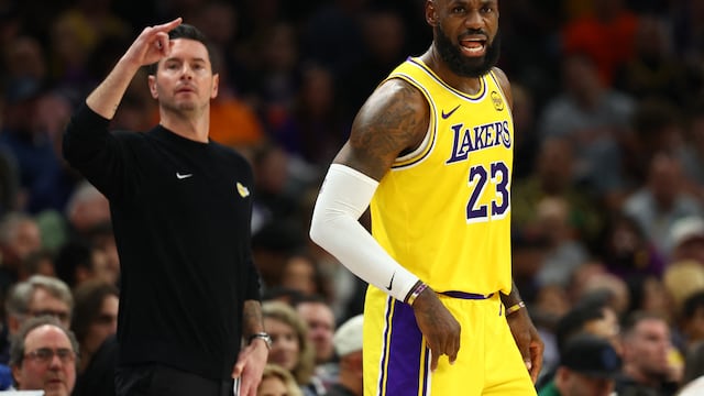 Dec 23, 2025; Phoenix, Arizona, USA; Los Angeles Lakers forward LeBron James (23) and head coach JJ Redick against the Phoenix Suns in the first half at Mortgage Matchup Center. Mandatory Credit: Mark J. Rebilas-Imagn Images