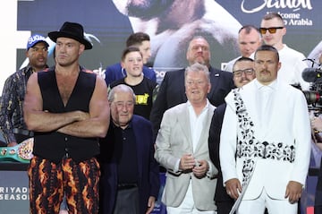 Tyson Fury (L) and Oleksandr Usyk (R) pose after attending a press conference in Riyadh, Saudi Arabia.