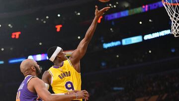 February 10, 2020; Los Angeles, California, USA; Los Angeles Lakers guard Rajon Rondo (9) moves in for a basket ahead of Phoenix Suns guard Jevon Carter (4) during the first half at Staples Center. Mandatory Credit: Gary A. Vasquez-USA TODAY Sports