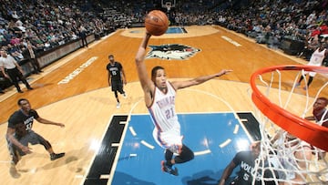 MINNEAPOLIS, MN -  DECEMBER 12:  Andre Roberson #21 of the Oklahoma City Thunder goes up for a dunk against the Minnesota Timberwolves on December 12, 2014 at Target Center in Minneapolis, Minnesota. NOTE TO USER: User expressly acknowledges and agrees that, by downloading and or using this Photograph, user is consenting to the terms and conditions of the Getty Images License Agreement. Mandatory Copyright Notice: Copyright 2014 NBAE (Photo by David Sherman/NBAE via Getty Images)