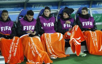 James (centre) on the Real Madrid bench in Yokohama on Sunday.