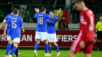 Italy's forward #18 Francesco Pio Esposito celebrates with a teammate after scoring his team's second goal during the 2026 World Cup qualifiers Europe zone group I football match between Moldova and Italy at the Zimbru Stadium in Chisinau, on November 13, 2025. (Photo by Daniel MIHAILESCU / AFP)