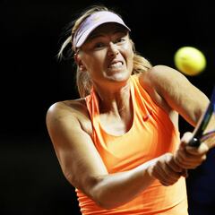 Sharapova fights back to reach Madrid second round setting up showdown with Bouchard