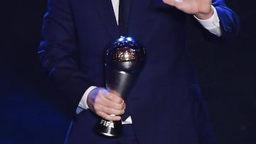 TOPSHOT - Argentina and Barcelona forward Lionel Messi reacts after winning the trophy for the Best FIFA Men&#039;s Player of 2019 Award, during The Best FIFA Football Awards ceremony, on September 23, 2019 in Milan. (Photo by Marco Bertorello / AFP)