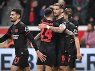 Bayer Leverkusen's German midfielder #08 Robert Andrich celebrates scoring the 2-0 goal with his teammates during the German first division Bundesliga football match between Bayer 04 Leverkusen and 1 FC Cologne in Leverkusen, western Germany, on December 13, 2025. (Photo by UWE KRAFT / AFP) / DFL REGULATIONS PROHIBIT ANY USE OF PHOTOGRAPHS AS IMAGE SEQUENCES AND/OR QUASI-VIDEO