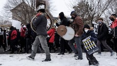 A child joins students during a state-wide walkout demanding justice for Amir Locke a Black man who was shot and killed by Minneapolis police, in St. Paul, Minnesota.