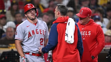 Jul 3, 2023; San Diego, California, USA; Los Angeles Angels center fielder Mike Trout (27) is checked by a trainer after an injury sustained during an at-bat in the eighth inning against the San Diego Padres at Petco Park. Mandatory Credit: Orlando Ramirez-USA TODAY Sports