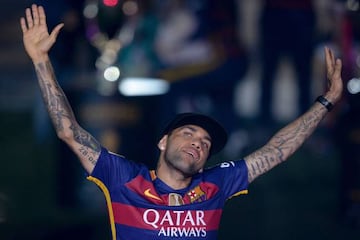 Alves, who is to leave the Camp Nou after eight years, celebrates Barça's league and cup double this season.