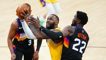 Jun 1, 2021; Phoenix, Arizona, USA; Los Angeles Lakers forward LeBron James (23) drives to the basket against Phoenix Suns center Deandre Ayton (22) in the first half during game five in the first round of the 2021 NBA Playoffs at Phoenix Suns Arena. Mandatory Credit: Mark J. Rebilas-USA TODAY Sports