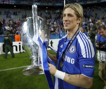 Semi-final hero Torres with the trophy after Chelsea's 2012 Champions League triumph.