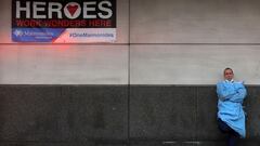 A doctor stands outside the emergency entrance at Maimonides Medical Center, as the spread of the coronavirus disease (COVID-19) continues, in Brooklyn, New York City, U.S., December 4, 2020.  REUTERS/Brendan McDermid     TPX IMAGES OF THE DAY