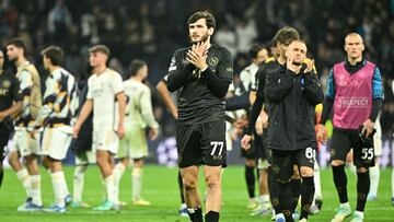 Napoli's Georgian forward #77 Khvicha Kvaratskhelia claps at the end of the UEFA Champions League first round group C football match between Real Madrid CF and SSC Naples at the Santiago Bernabeu stadium in Madrid on November 29, 2023. (Photo by JAVIER SORIANO / AFP)