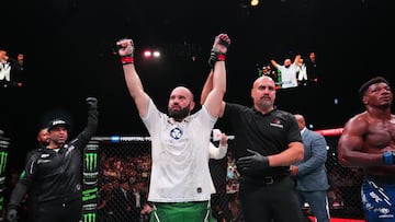 ABU DHABI, UNITED ARAB EMIRATES - AUGUST 03: (L-R) Azamat Murzakanov of Russia reacts after defeating Alonzo Menifield in a lightweight fight during the UFC Fight Night event at Etihad Arena on August 03, 2024 in Abu Dhabi, United Arab Emirates. (Photo by Josh Hedges/Zuffa LLC via Getty Images)